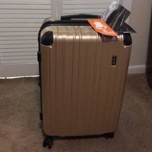 Brand new golden suitcase.
